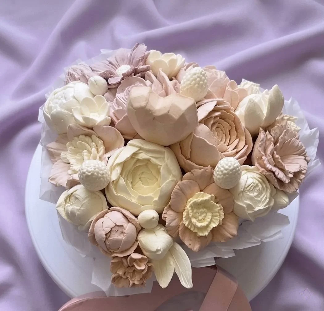 Close view of a cream and blush handmade marshmallow flower bouquet